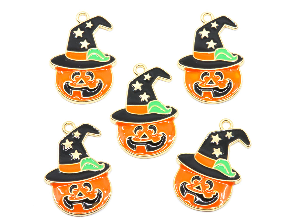 Five Halloween-themed enamel charms shaped like orange jack-o'-lantern pumpkins wearing black witch hats with gold-tone outlines, white stars, and green accents, arranged on a plain white background.