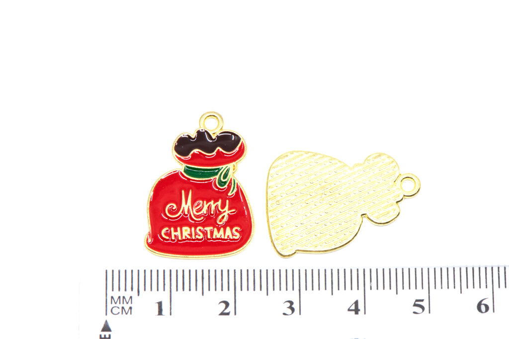 Two red Santa bag Christmas-themed metal charms, displayed above a ruler for scale on a white background.