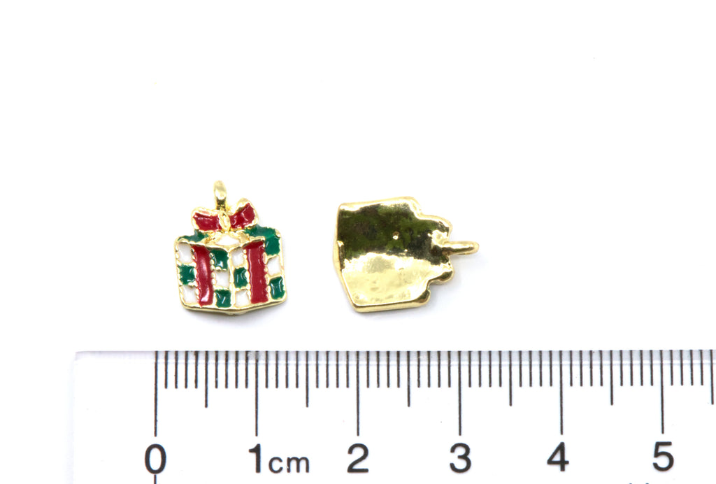 Two Christmas present gold-tone charms on a white background, cm ruler below for scale.