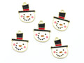Five snowman face charms with gold-tone metal borders, black top hats, red bands, pink cheeks, and black dot facial features on a white background.
