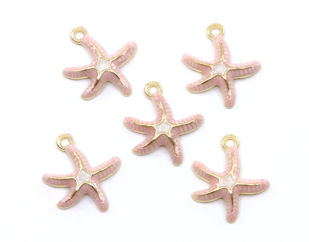 Five pink starfish charms with gold-tone metal outlines and loops, arranged on a plain white background.