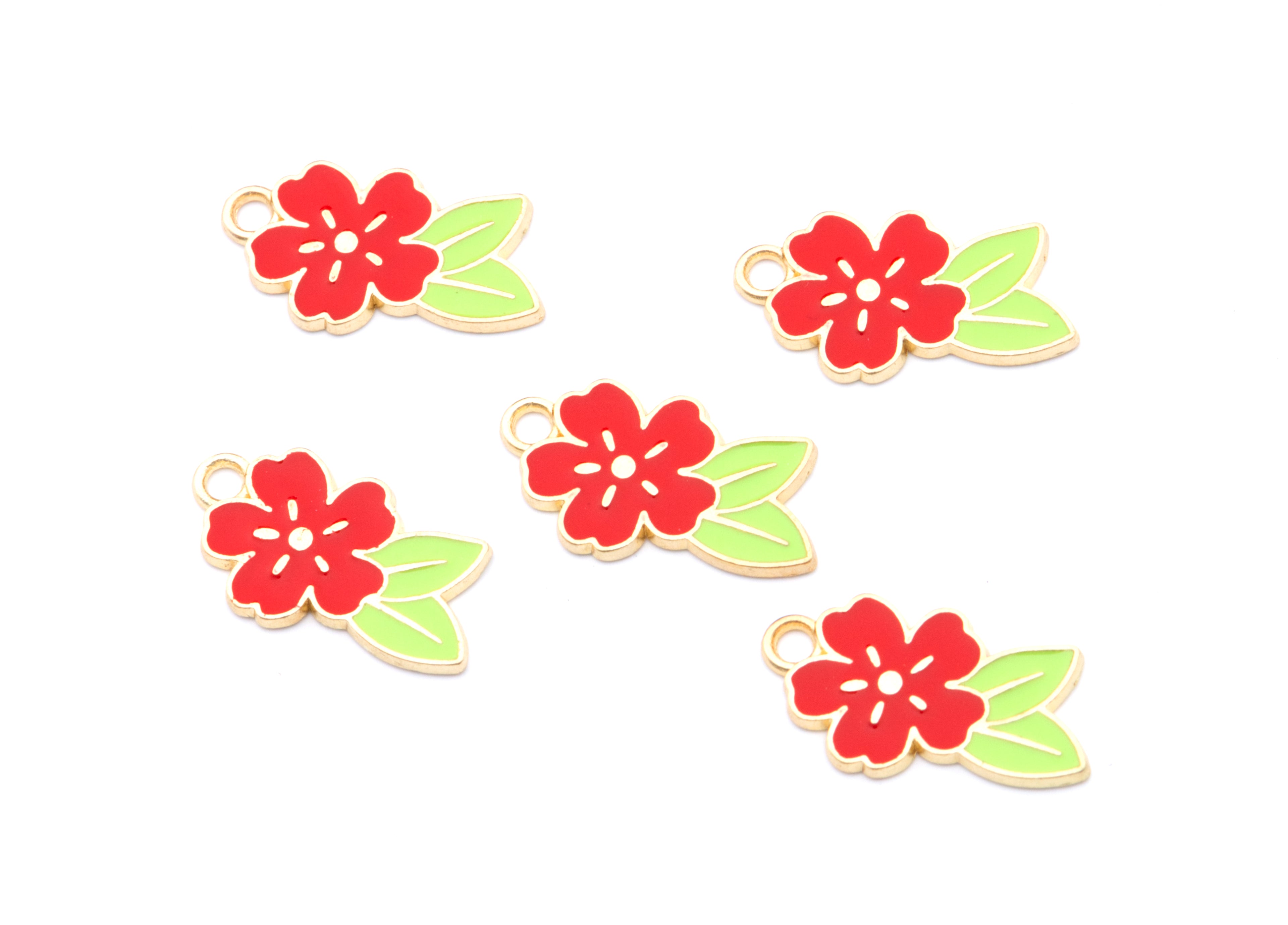 Five small red flower charms with light green leaves and gold-tone loops, arranged on a plain white background.