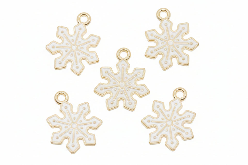 Five white snowflake-shaped jewelry charms with gold-tone loops at the top, arranged on a white background.