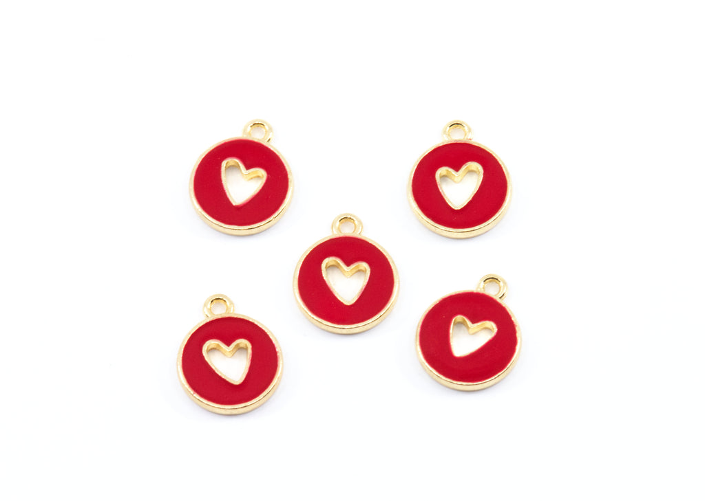 Five round red enamel charms with gold-tone metal borders and a cutout heart in the center, arranged on a plain white background.