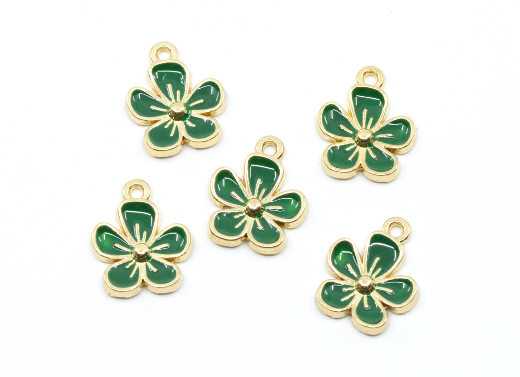 Five green enamel flower charms with gold-tone metal borders and loops, arranged on a plain white background.