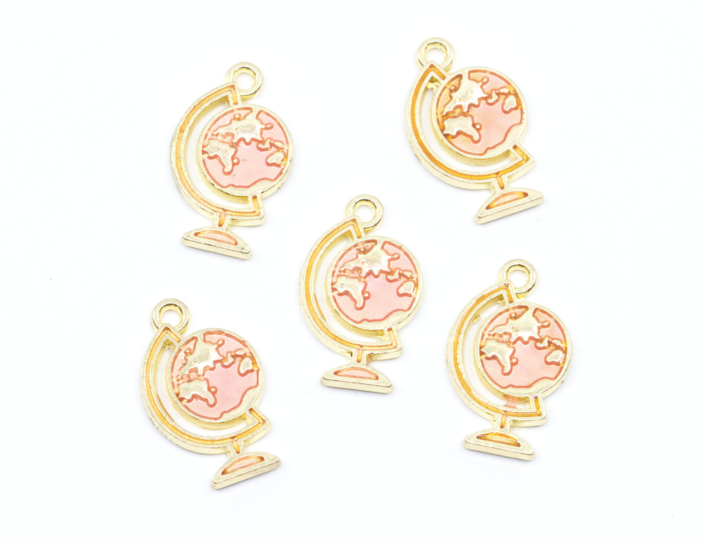 Five gold globe charms with light pink enamel details, arranged on a plain white background.