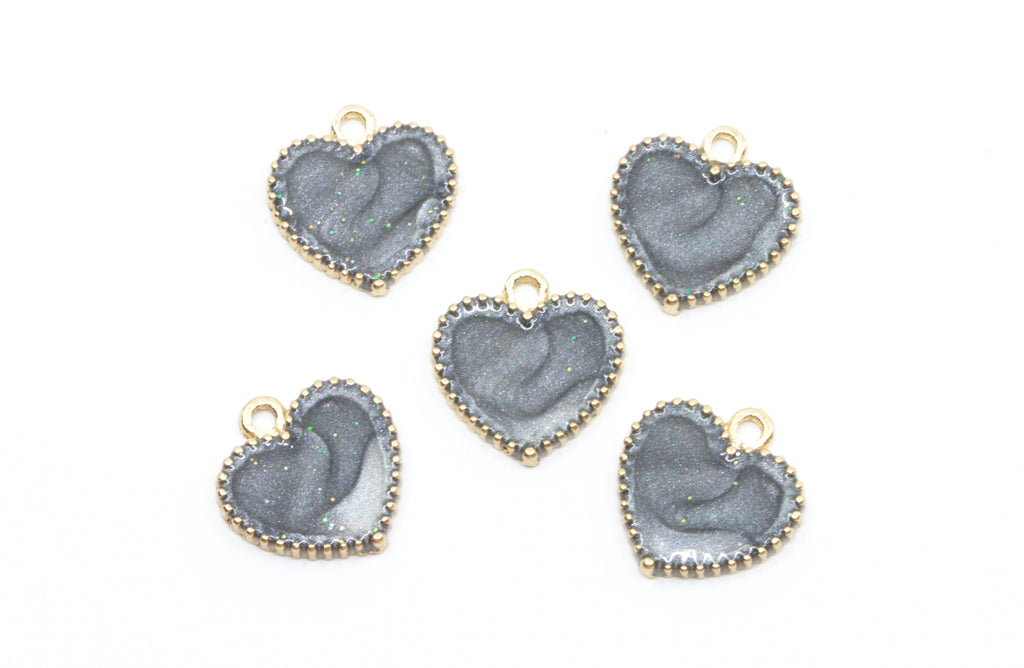 Five heart-shaped jewelry charms with a  gray center and gold-tone edges, arranged on a plain white background.