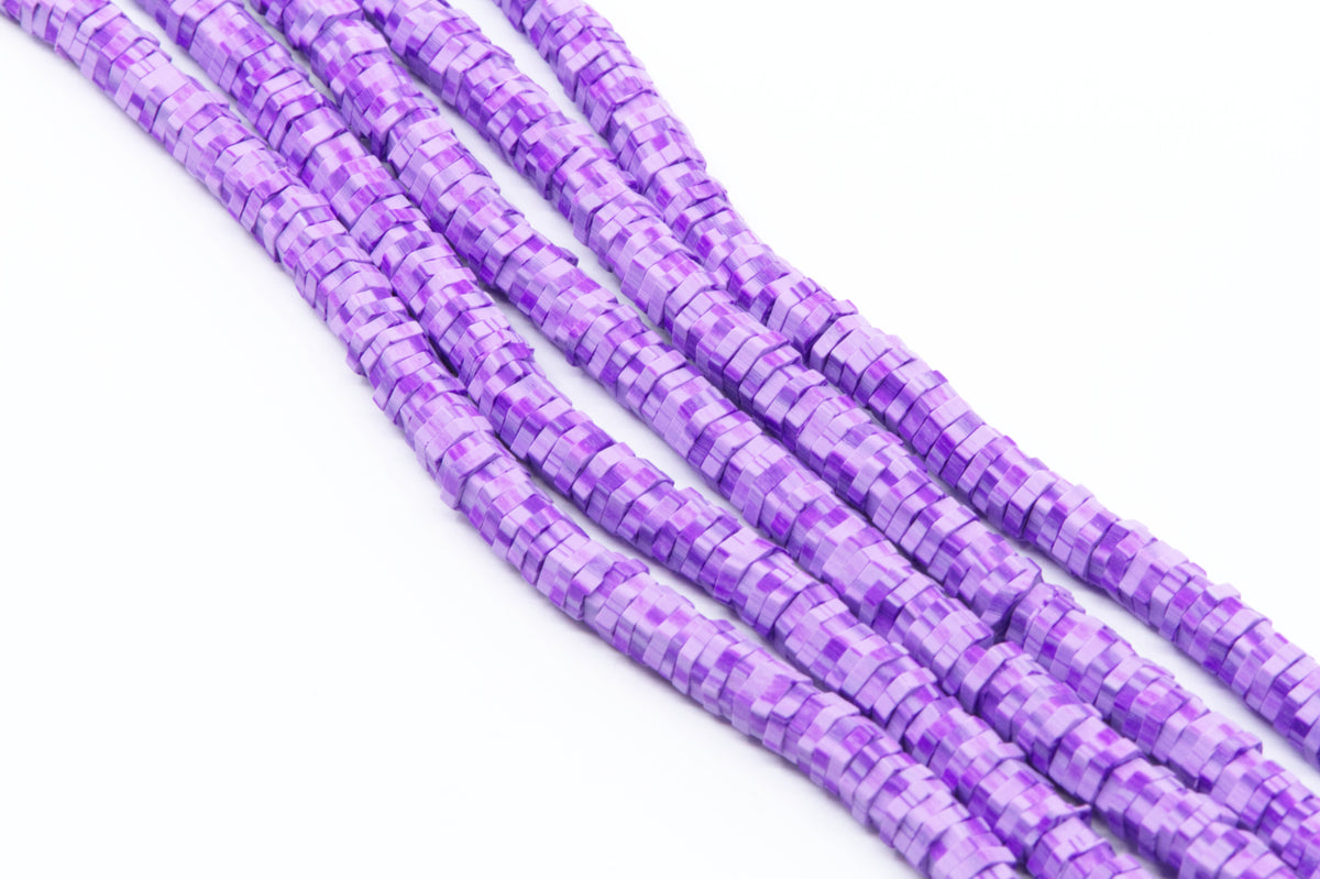 multiple strands of purple polymer clay hexagon disc beads arranged in diagonal strands on a white background.