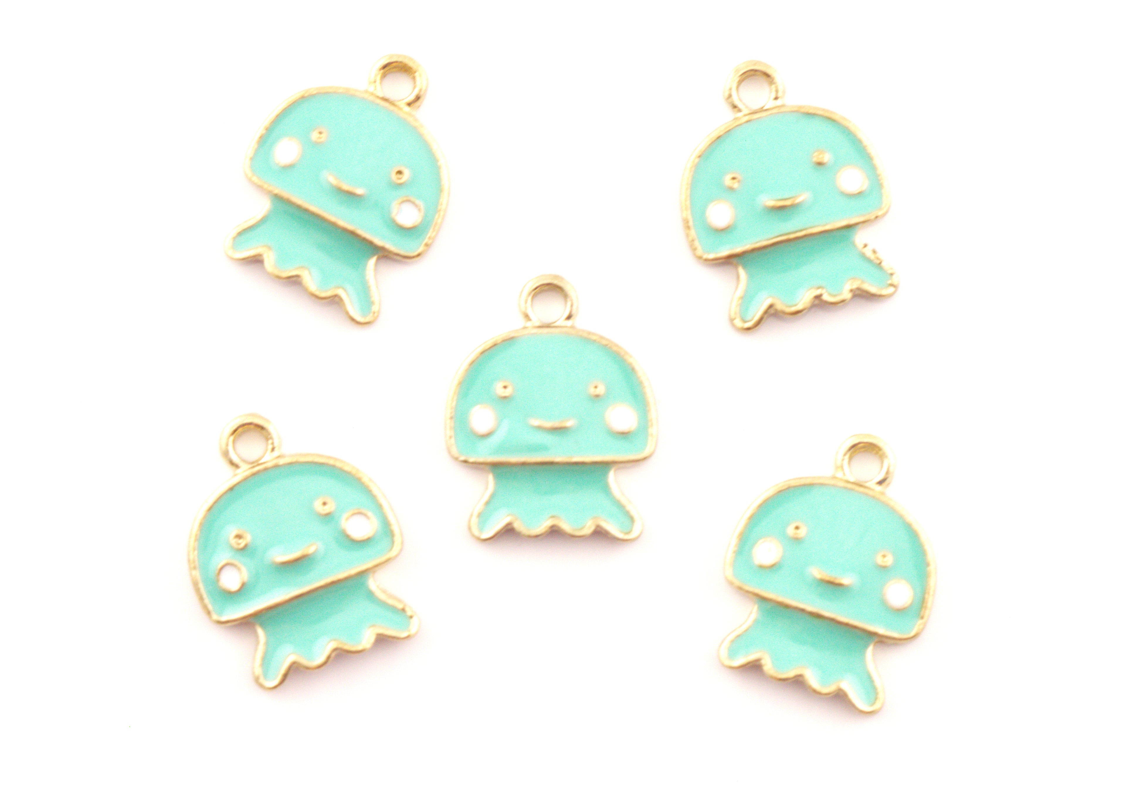 Five mint green jellyfish charms with gold-plated edges and white facial details, arranged on a plain white background.