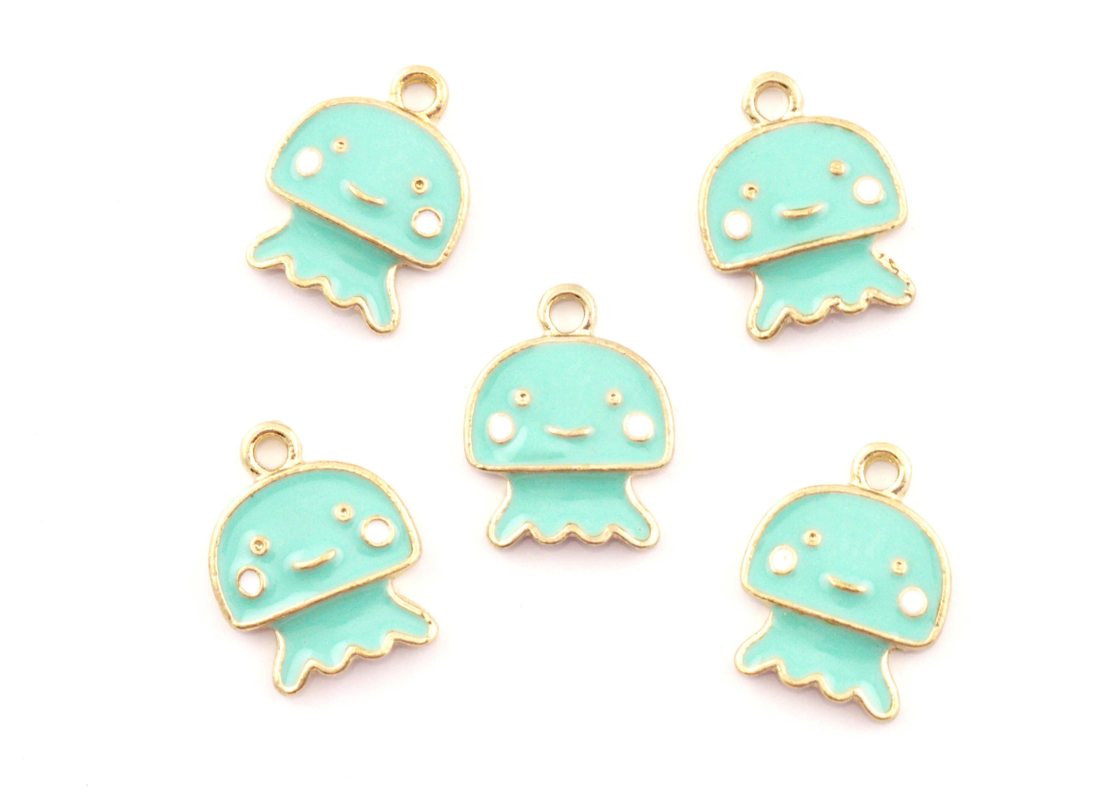 Five mint green jellyfish charms with gold-plated edges and white facial details, arranged on a plain white background.