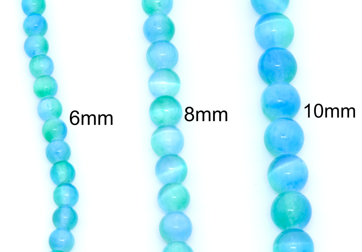 Three strands of round dyed gypsum selenite blue and green bead strands shown in 6mm, 8mm, and 10mm sizes against a white background.