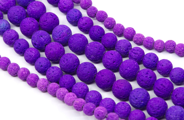Purple and lava stone bead strands on a white background.