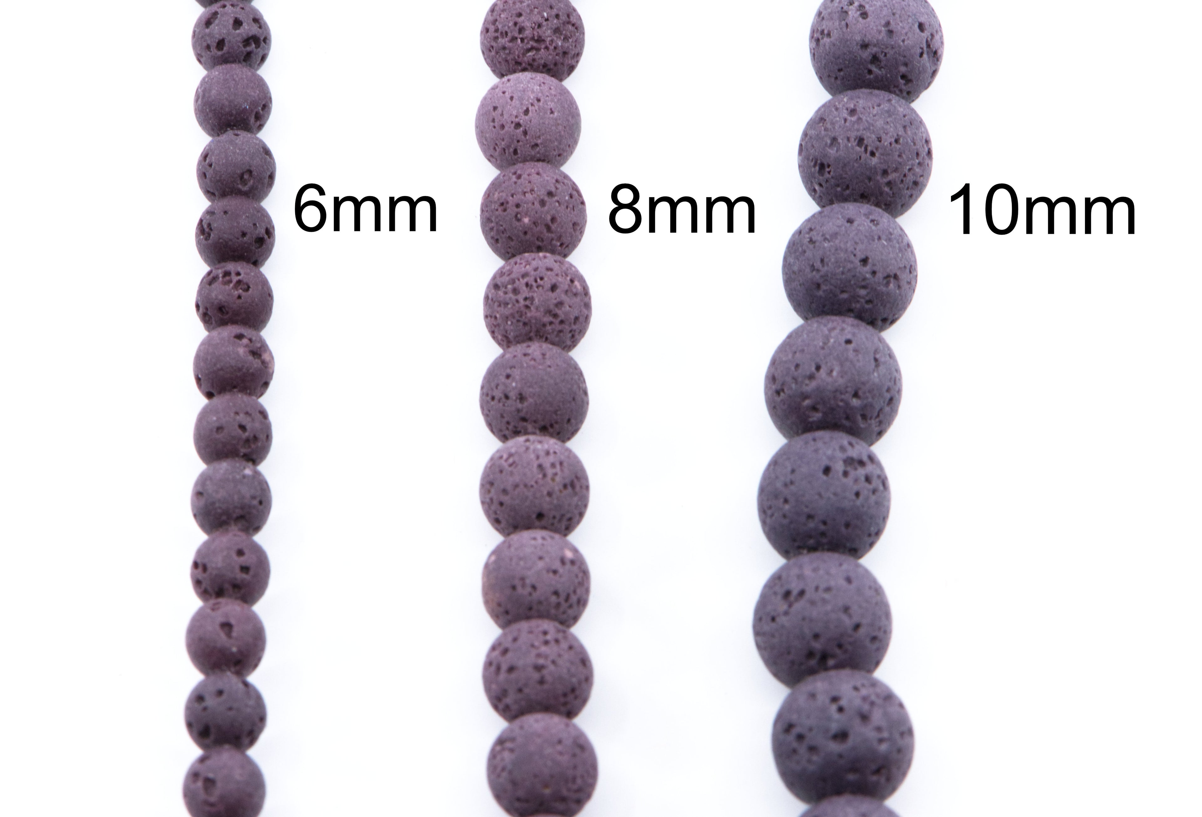 Three strands of dark purple porous lava stone beads shown in 6mm, 8mm, and 10mm lengths on a white background.