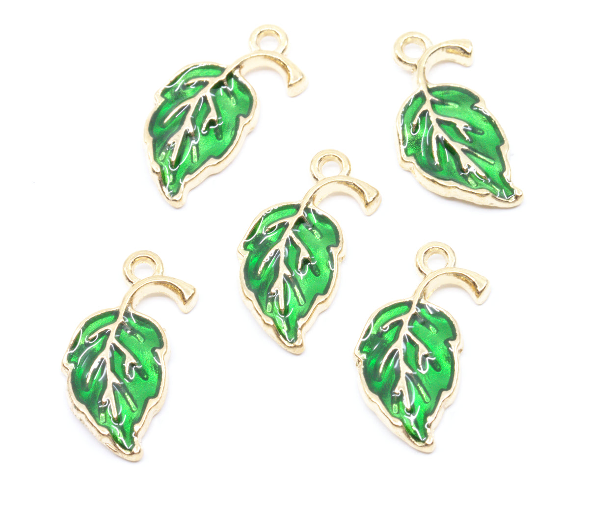 Five green leaf-shaped jewelry charms with gold-tone metal borders and hanging loops, arranged on a plain white background.