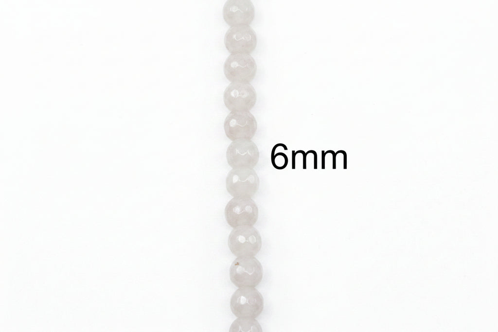 A single strand of faceted light gray faceted agate beads shown vertically on a white background, with the text '6mm' printed beside it to indicate bead size.