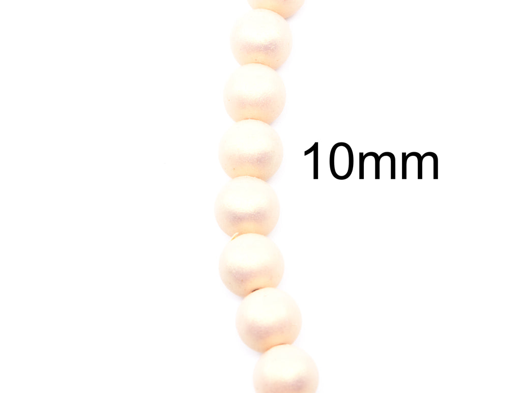 A close-up of a strand of shimmer peach colored  round acrylic beads with a '10mm' size indicator on a plain white background.