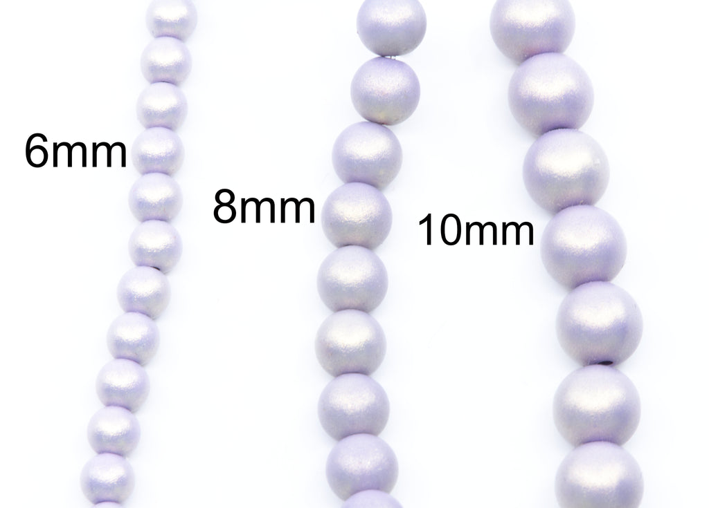 Three strands of light purple shimmery acrylic beads shown in 6mm, 8mm, and 10mm sizes on a white background with size labels.