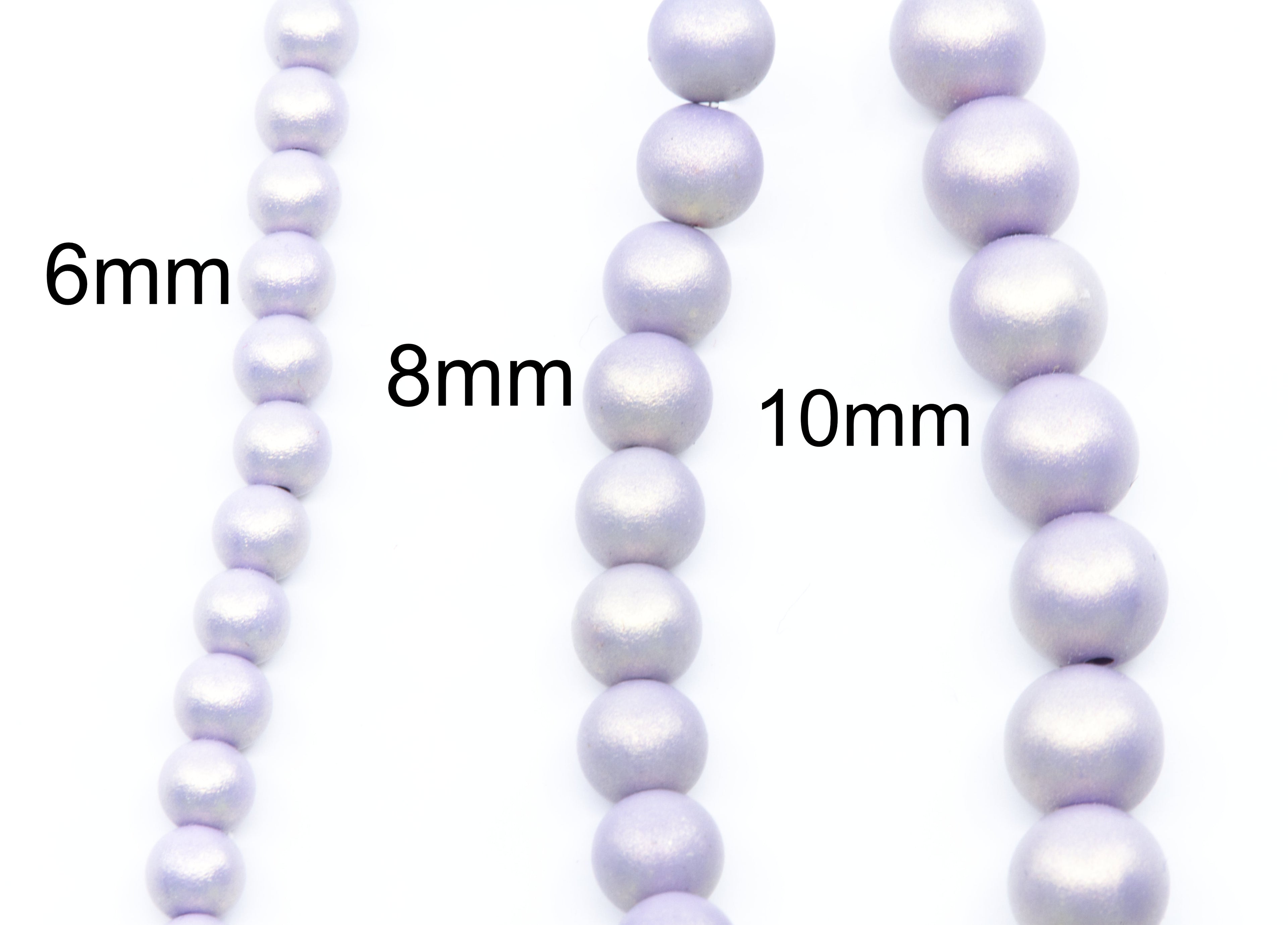 Three strands of light purple shimmery acrylic beads shown in 6mm, 8mm, and 10mm sizes on a white background with size labels.