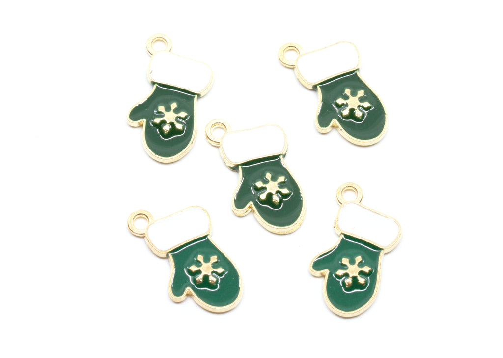 Five green and white Christmas stocking charms with gold-tone metal edges and loops, featuring a white snowflake design on the front, arranged on a plain white background.