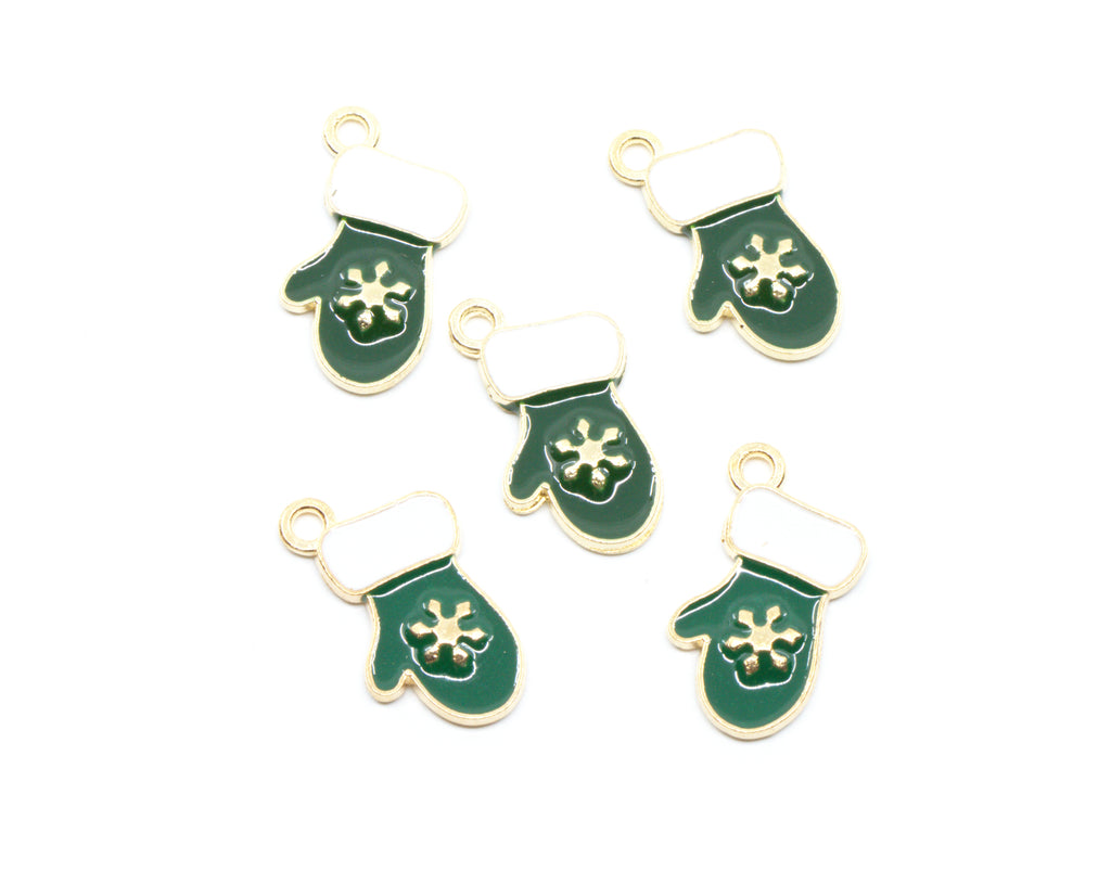 Five green and white Christmas stocking charms with gold-tone metal edges and loops, featuring a white snowflake design on the front, arranged on a plain white background.