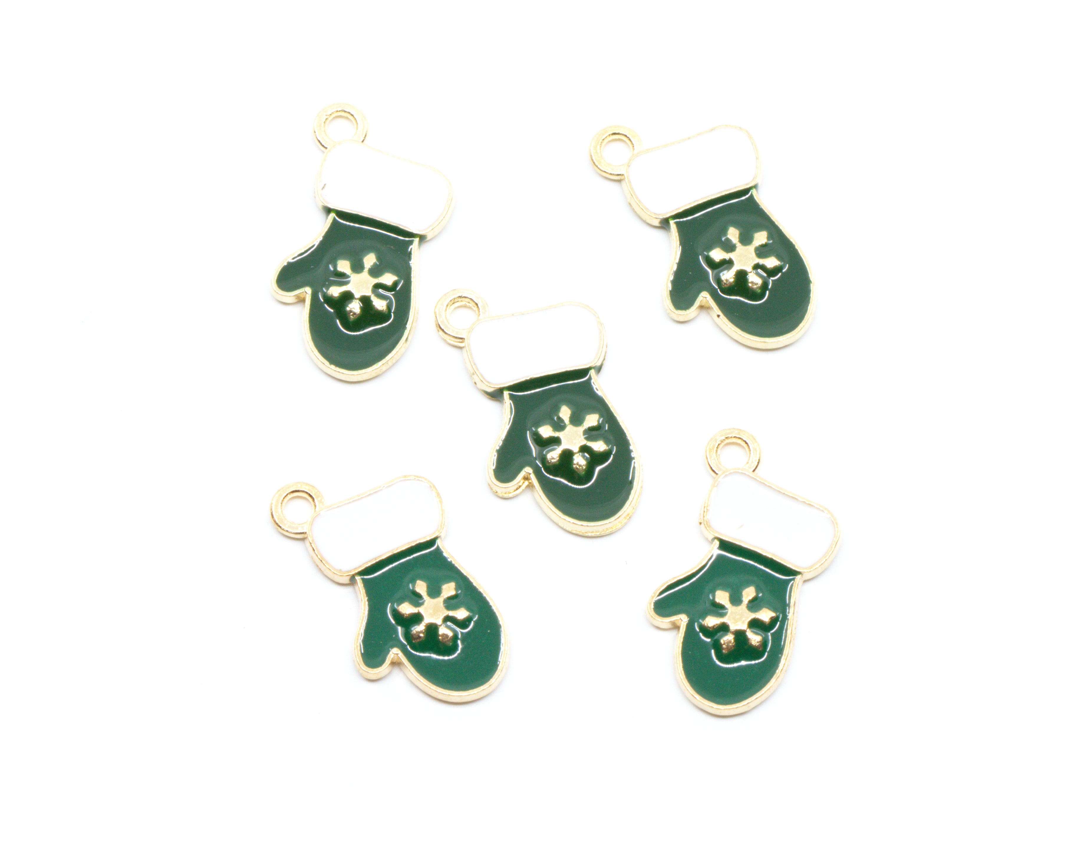 Five green and white Christmas stocking charms with gold-tone metal edges and loops, featuring a white snowflake design on the front, arranged on a plain white background.