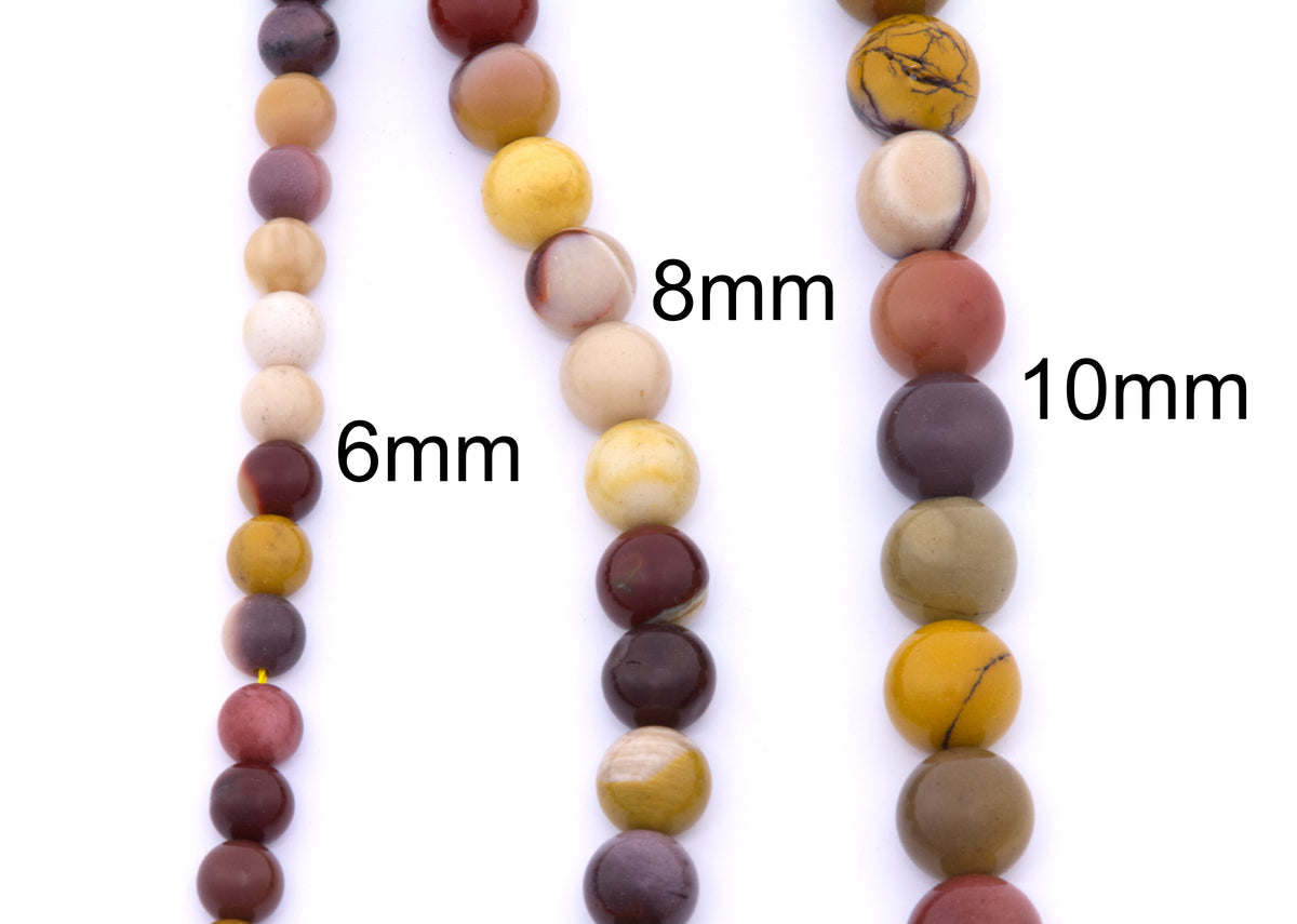 Three strands of round mookaite gemstone beads in different sizes (6mm, 8mm, and 10mm) displayed vertically on a white background, showing various earthy colors and natural stone patterns.