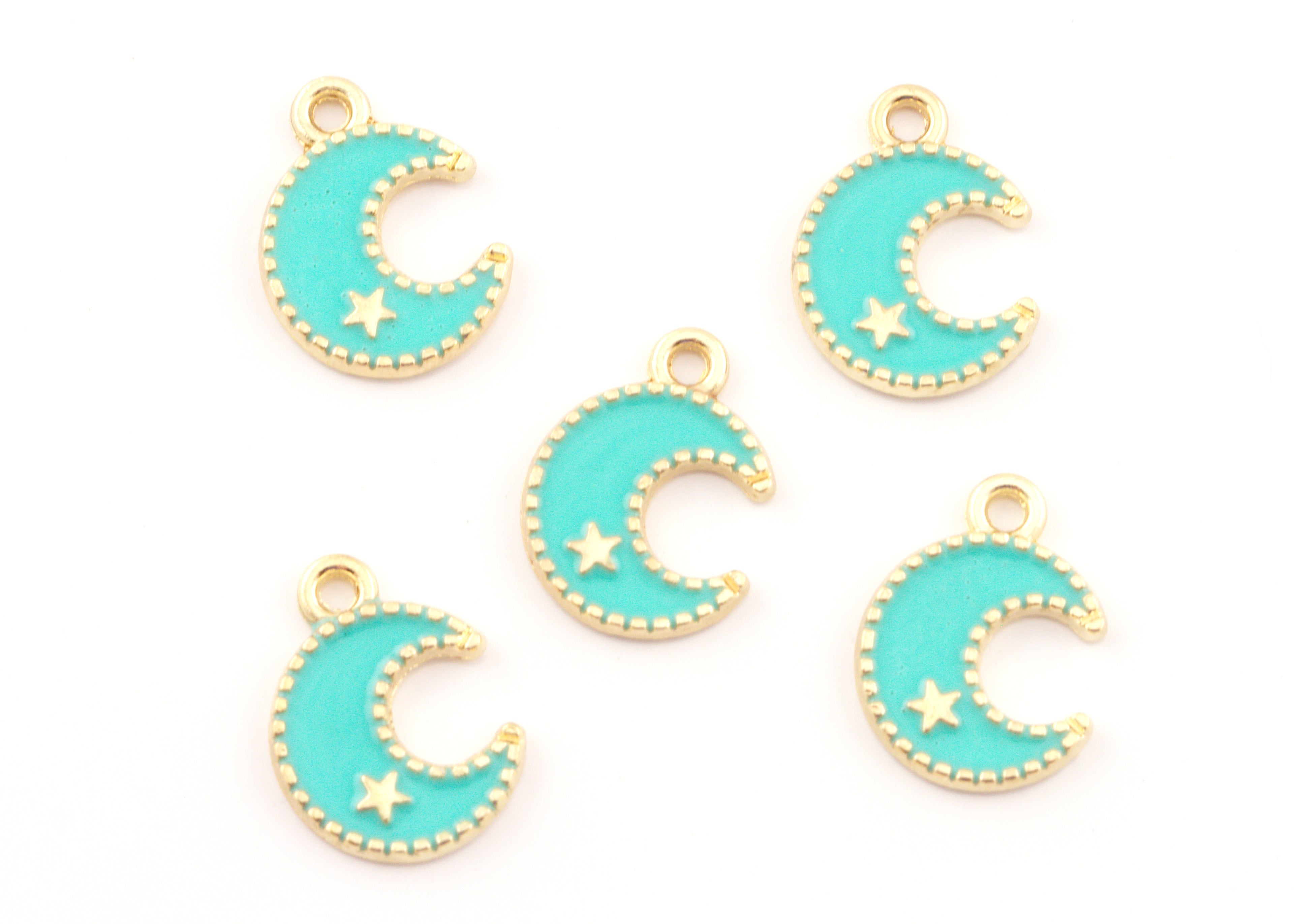 five blue crescent moon charms with a gold star detail displayed on a white background. 
