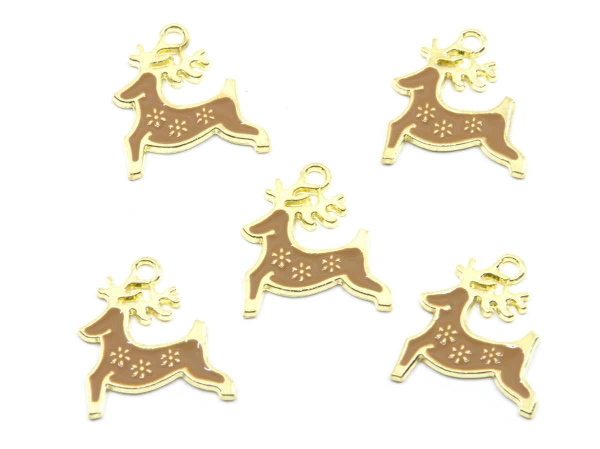 Five small gold-toned Christmas reindeer charms with brown enamel bodies and  snowflake details, arranged on a plain white background.