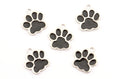 Five silver paw print charms with black enamel pads, arranged on a plain white background.