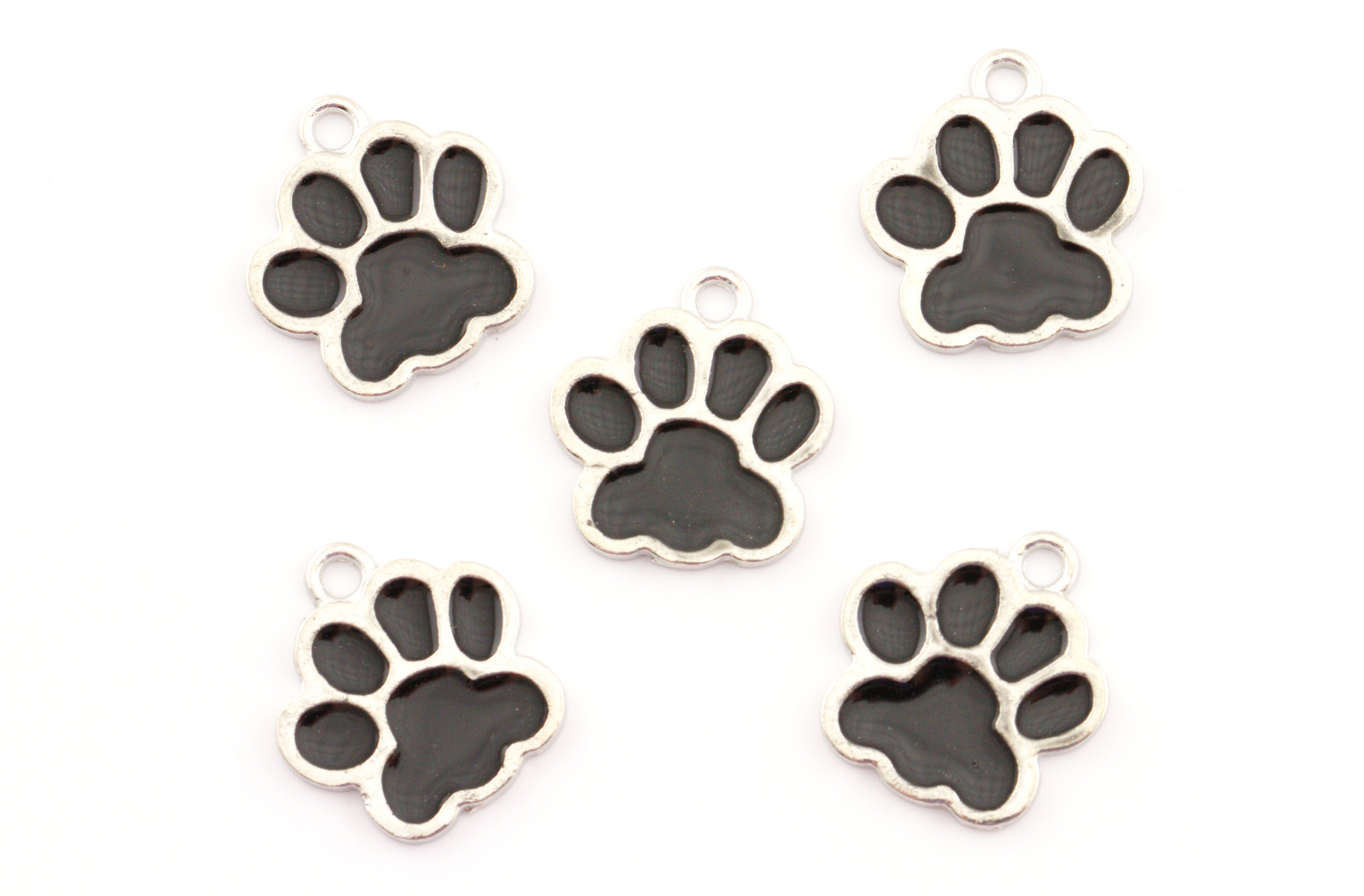 Five silver paw print charms with black enamel pads, arranged on a plain white background.