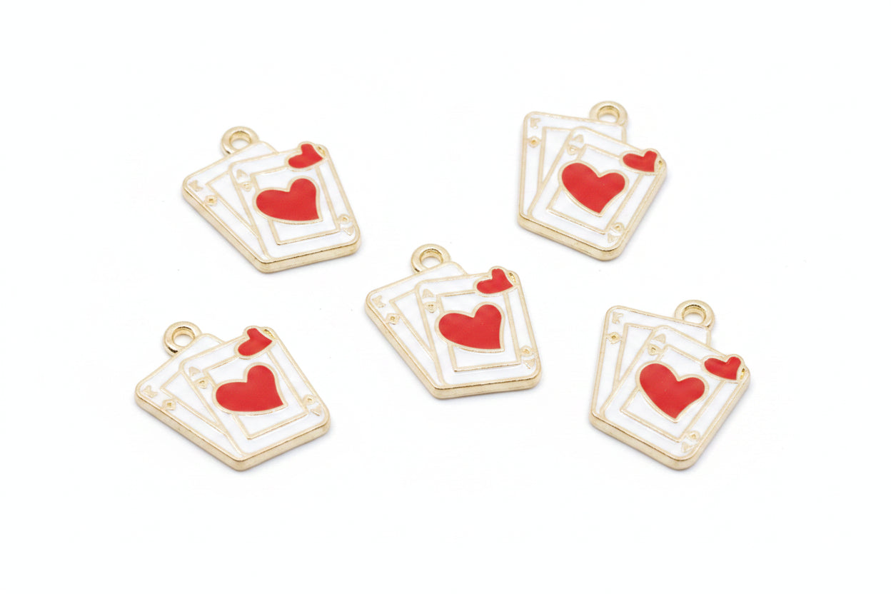 Five white and red playing card charms with red hearts, arranged on a white background. 
