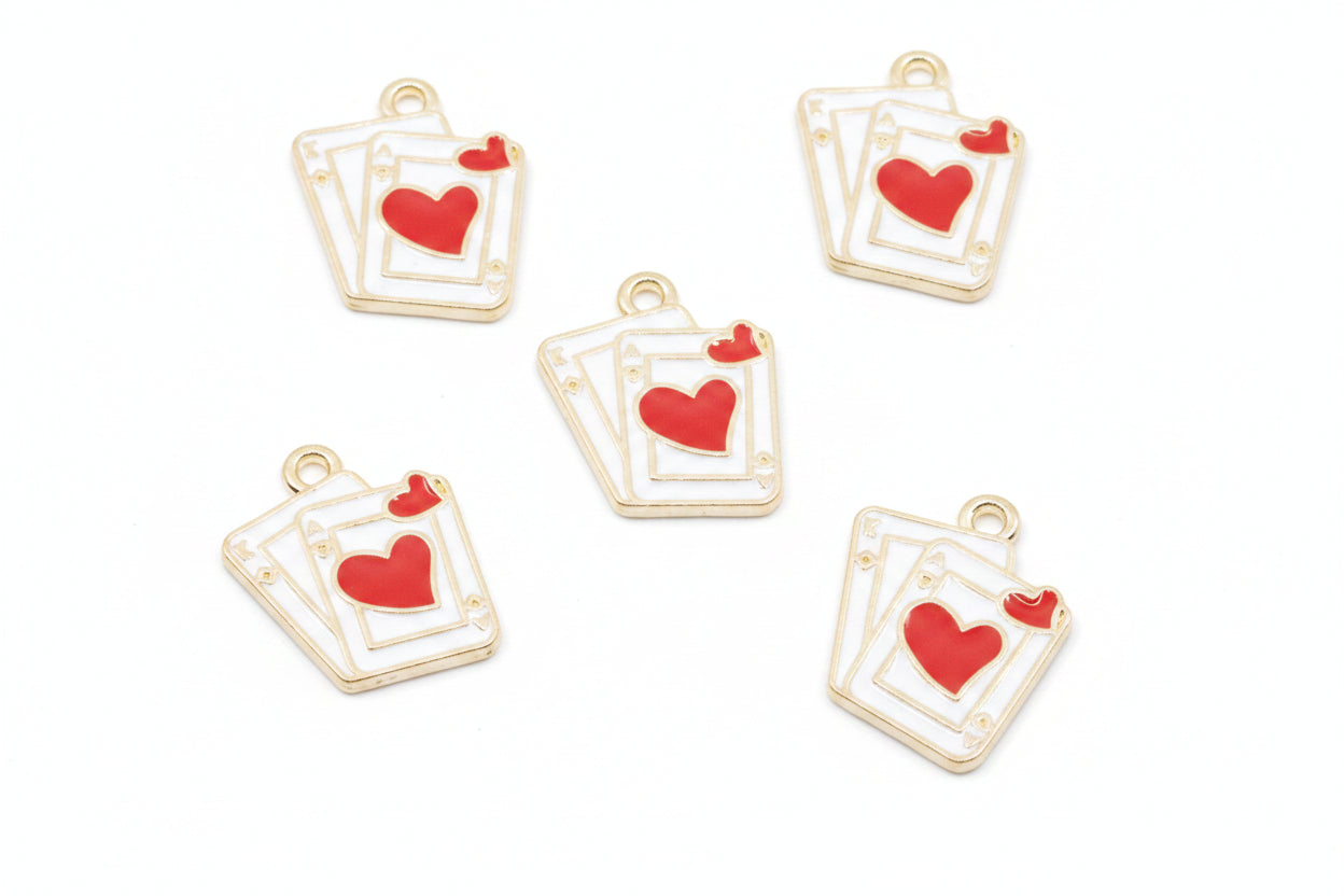 Five white and red playing card charms with red hearts, arranged on a white background. 