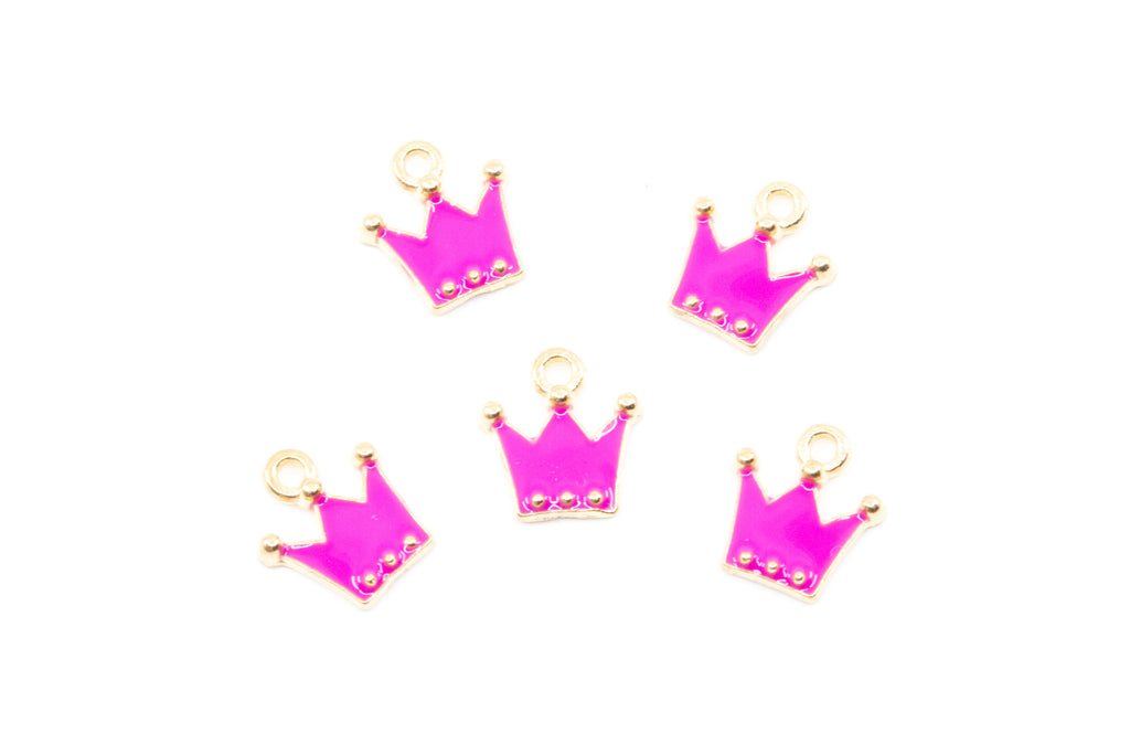 Five small crown-shaped jewelry charms in bright pink enamel with gold-tone metal borders and loops, arranged on a plain white background.