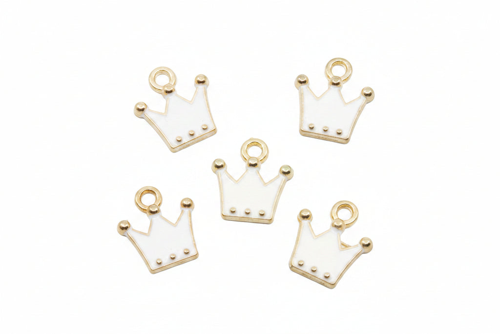 Five white crown-shaped jewelry charms with gold-tone metal borders and loops, arranged on a plain white background.