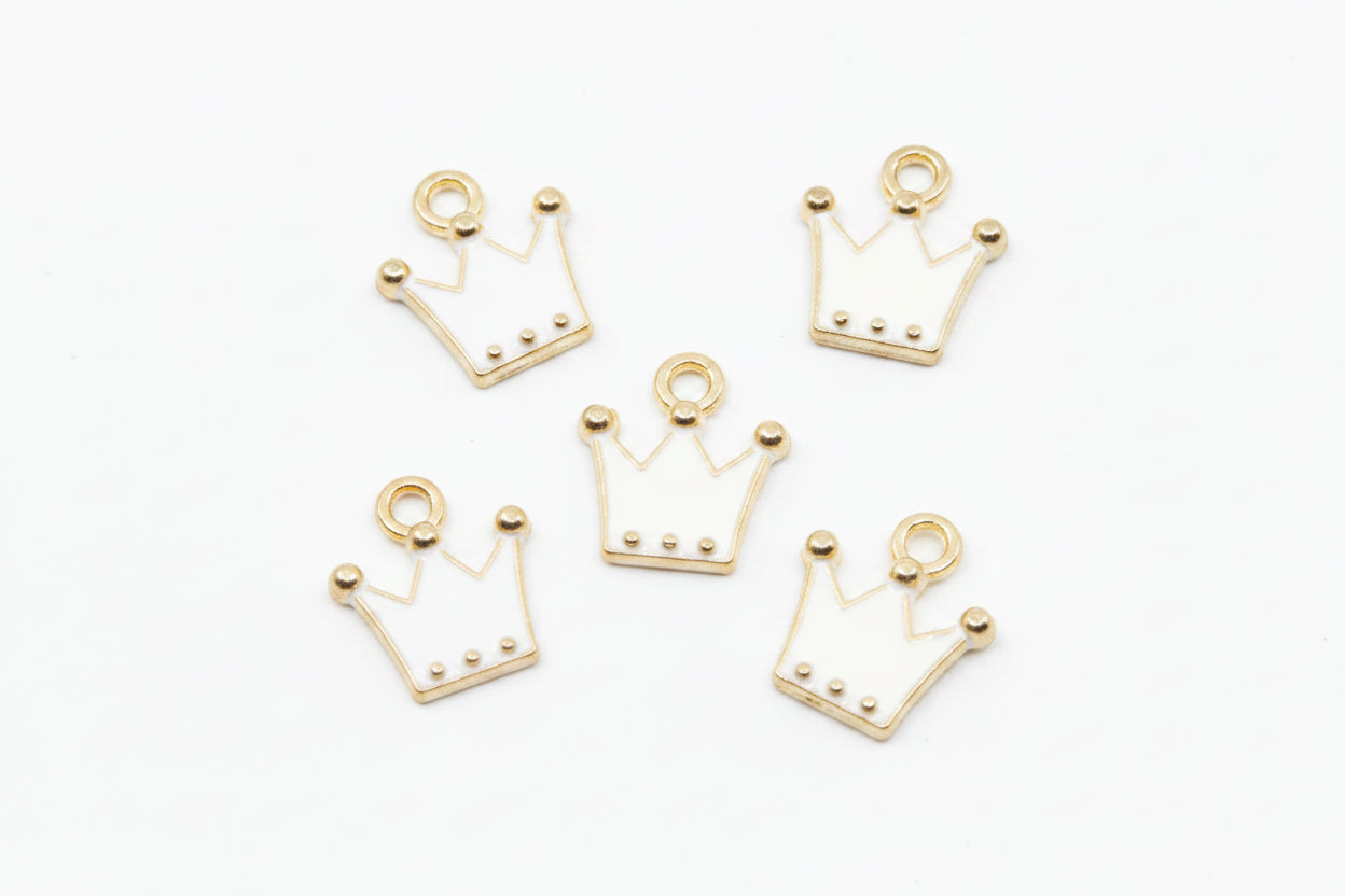 Five gold crown-shaped jewelry charms with small bead details, arranged on a plain white background.