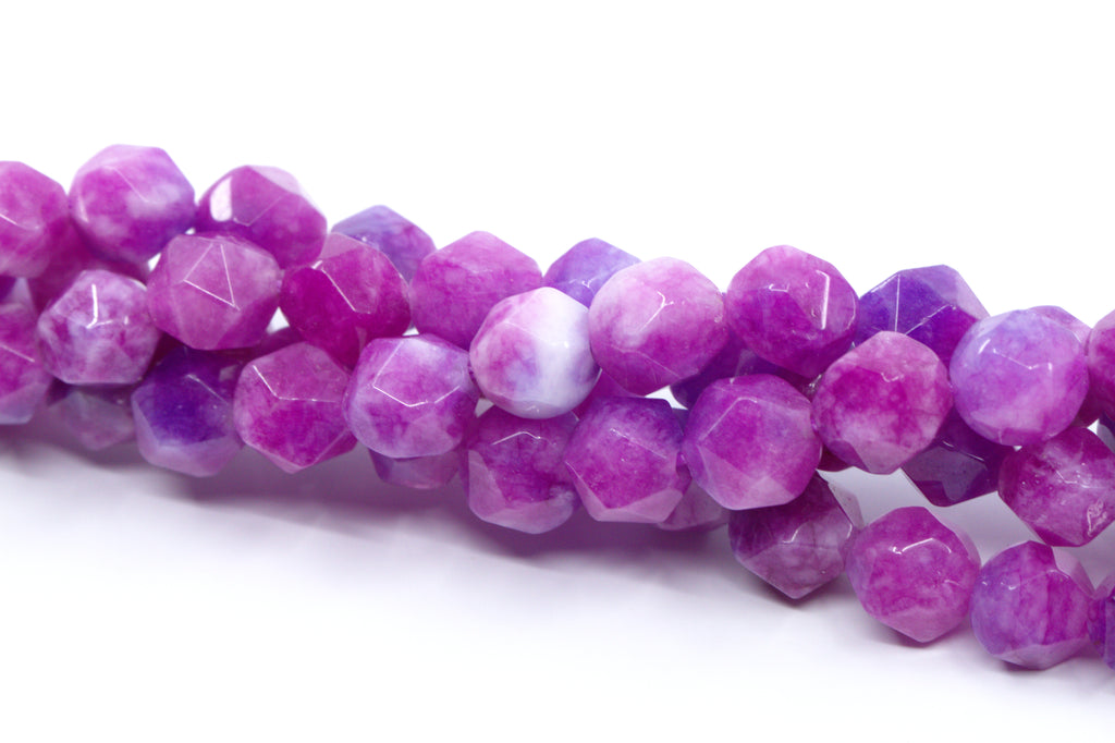 Faceted diamond cut gemstone beads in shades of purple and pink, arranged on a white background.