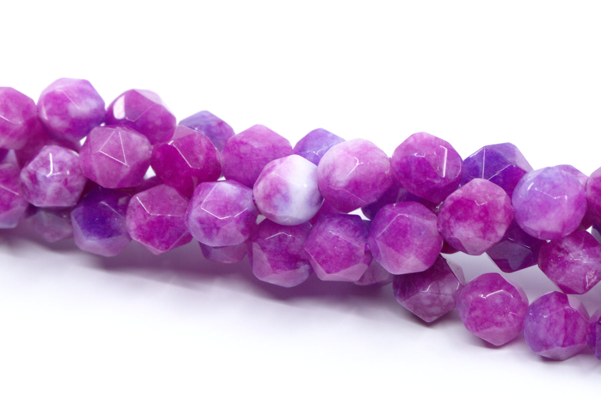 Faceted diamond cut gemstone beads in shades of purple and pink, arranged on a white background.