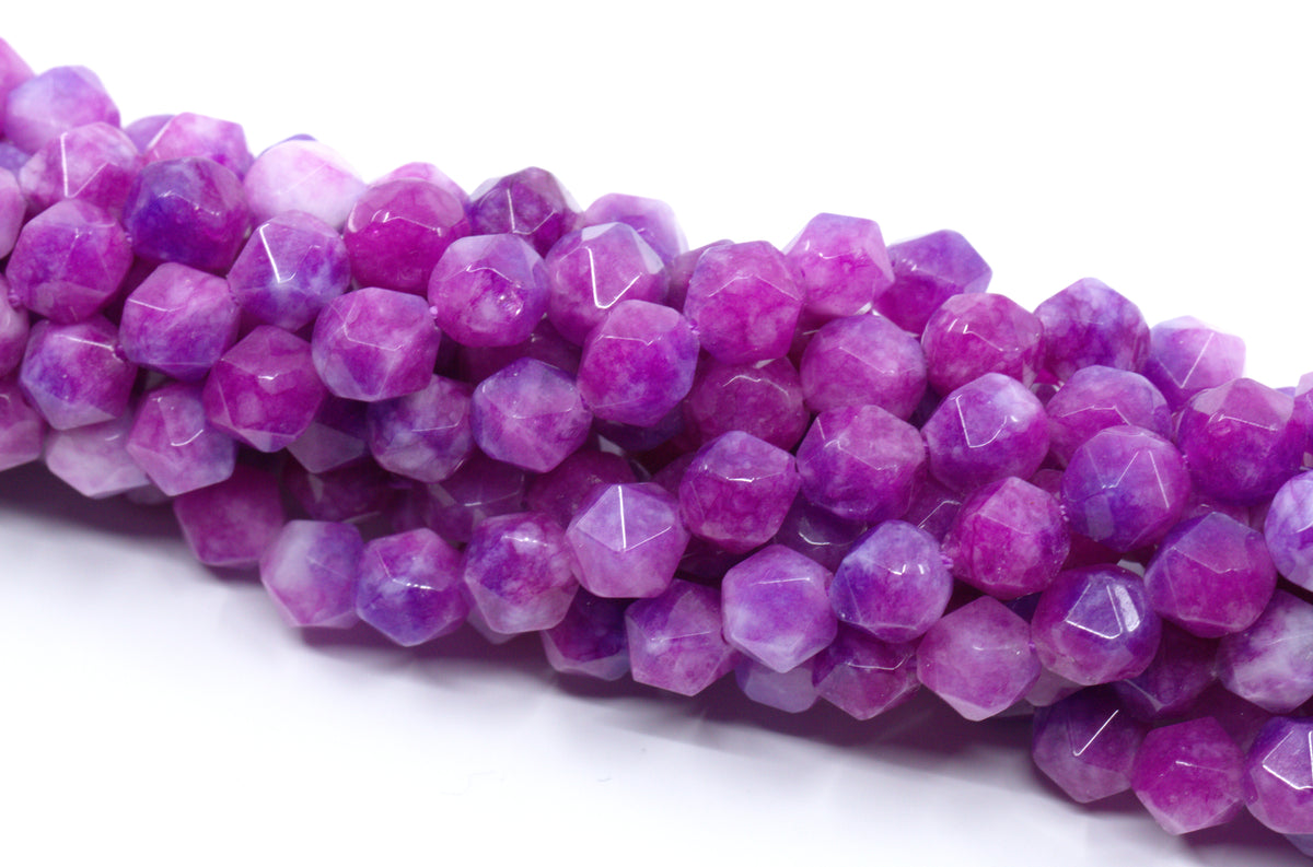 Faceted diamond cut gemstone beads in shades of purple and pink, arranged on a white background.