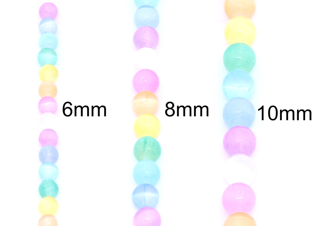 Three strands of pastel rainbow dyed gypsum selenite round beads shown vertically on a white background, labeled 6mm, 8mm, and 10mm to indicate bead size.