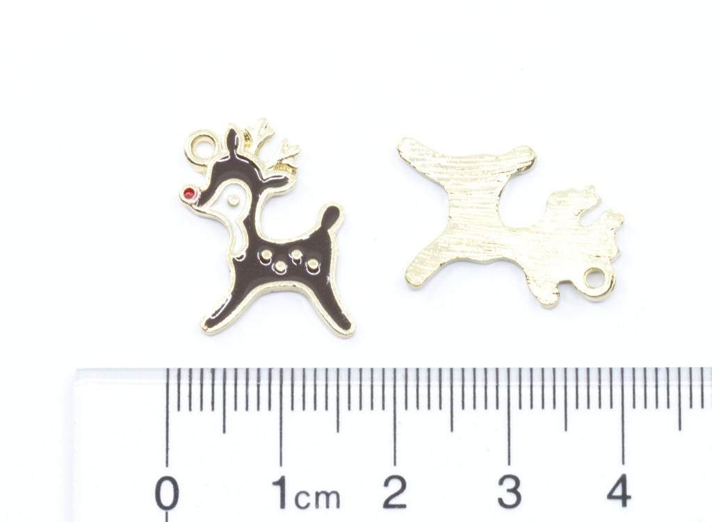 Two small  charms shaped like a reindeer, shown on a white background above a ruler for scale.