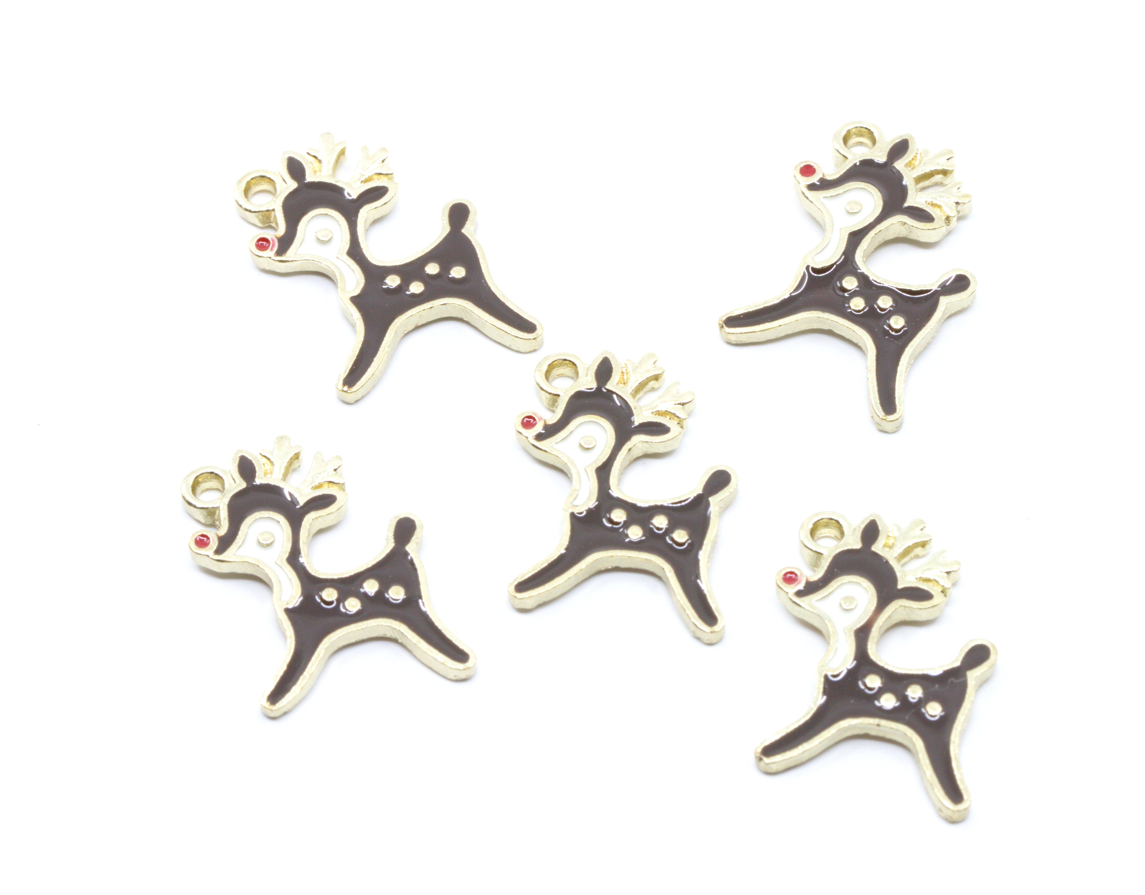 Five Christmas reindeer charms with gold-tone metal outlines and dark brown enamel fillings,  featuring a tiny red nose accent, arranged on a plain white background.