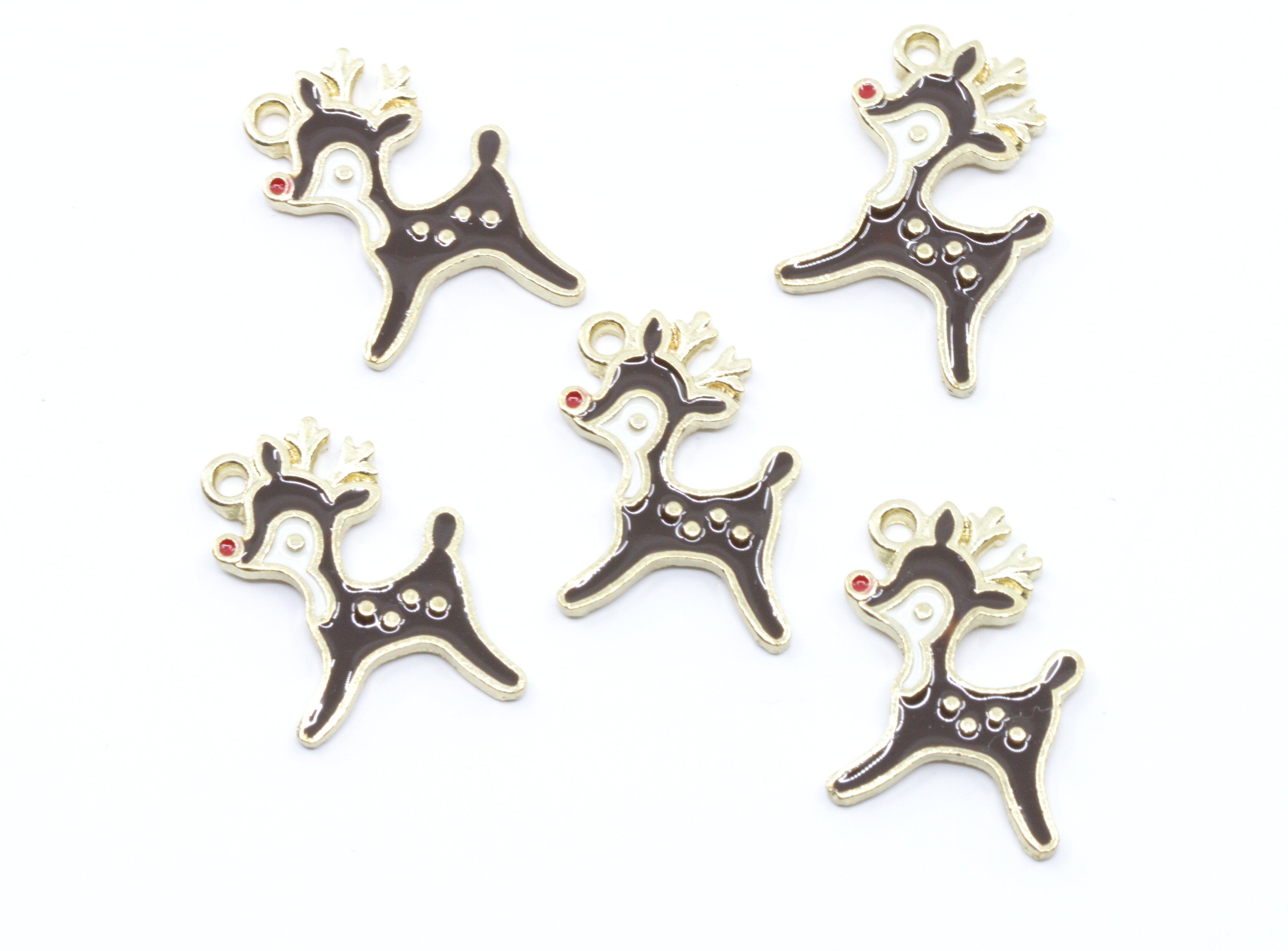 Five Christmas reindeer charms with gold-tone metal outlines and dark brown enamel fillings,  featuring a tiny red nose accent, arranged on a plain white background.