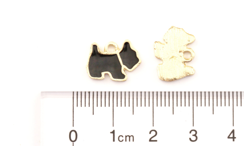 Two small dog-shaped jewelry charms,  displayed above a  cm ruler for scale on a white background.