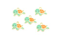 Five small turtle charms with mint green heads and flippers, orange shells, and gold-tone outlines on a plain white background.