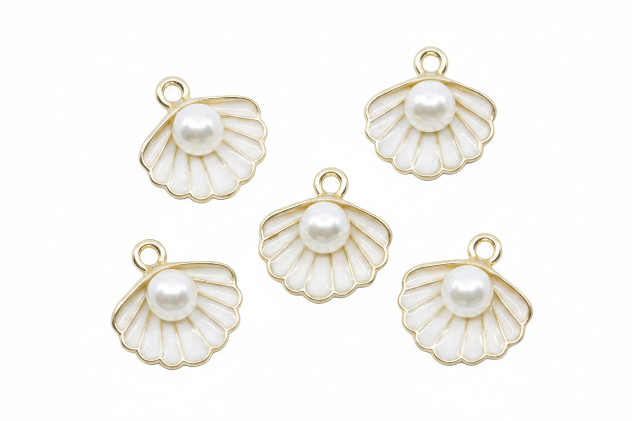 Five gold-plated white shell charms with white faux pearl centers, arranged on a white background.
