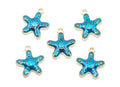 Five blue starfish charms with gold metal borders and loops, arranged on a plain white background.