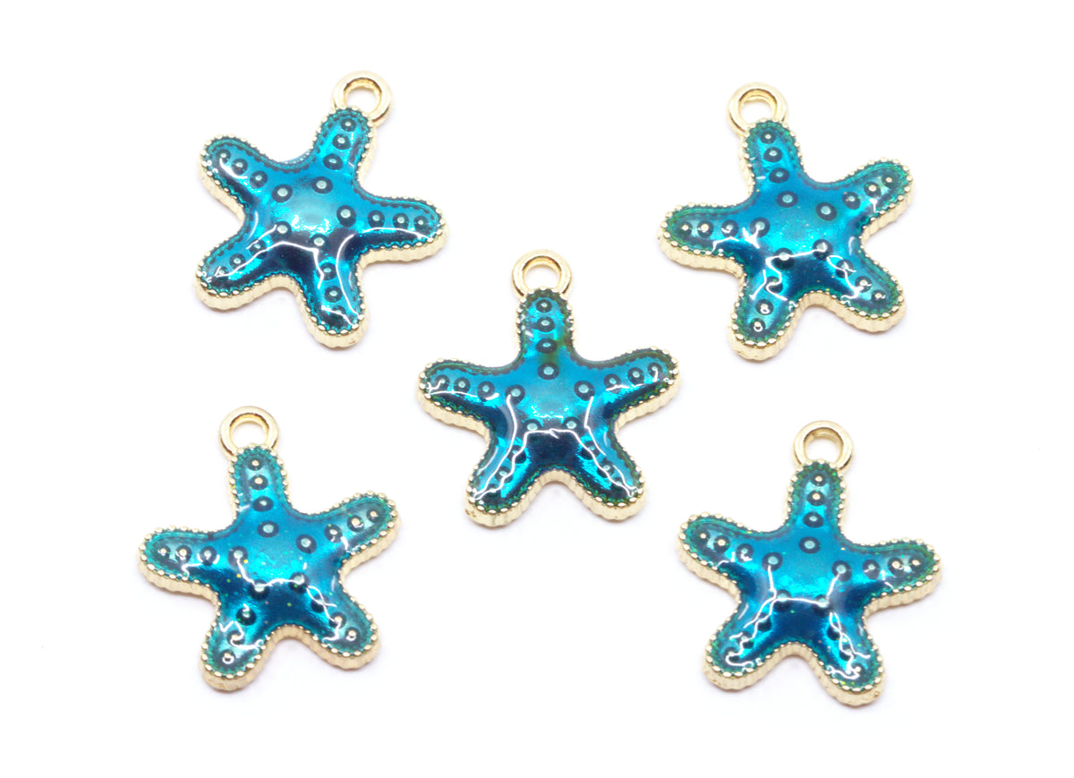Five blue starfish charms with gold metal borders and loops, arranged on a plain white background.