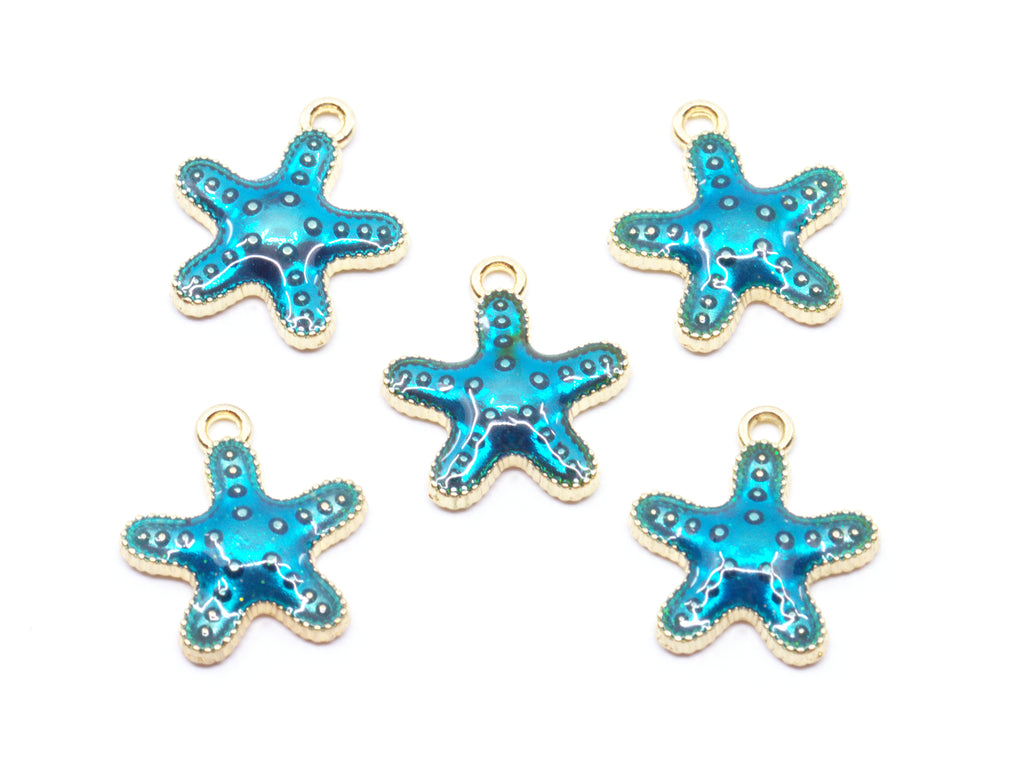 Five blue starfish charms with gold metal borders and loops, arranged on a plain white background.
