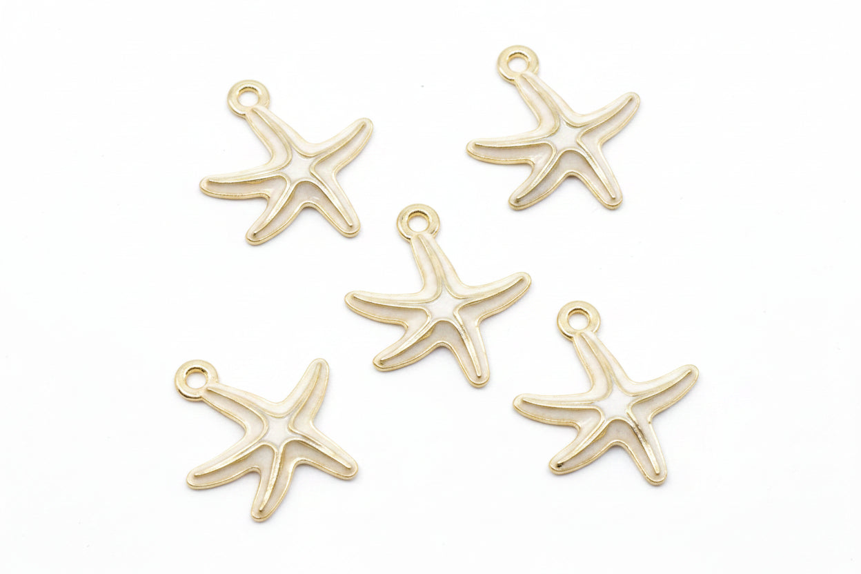 Five white and cream starfish-shaped jewelry charms arranged on a plain white background.