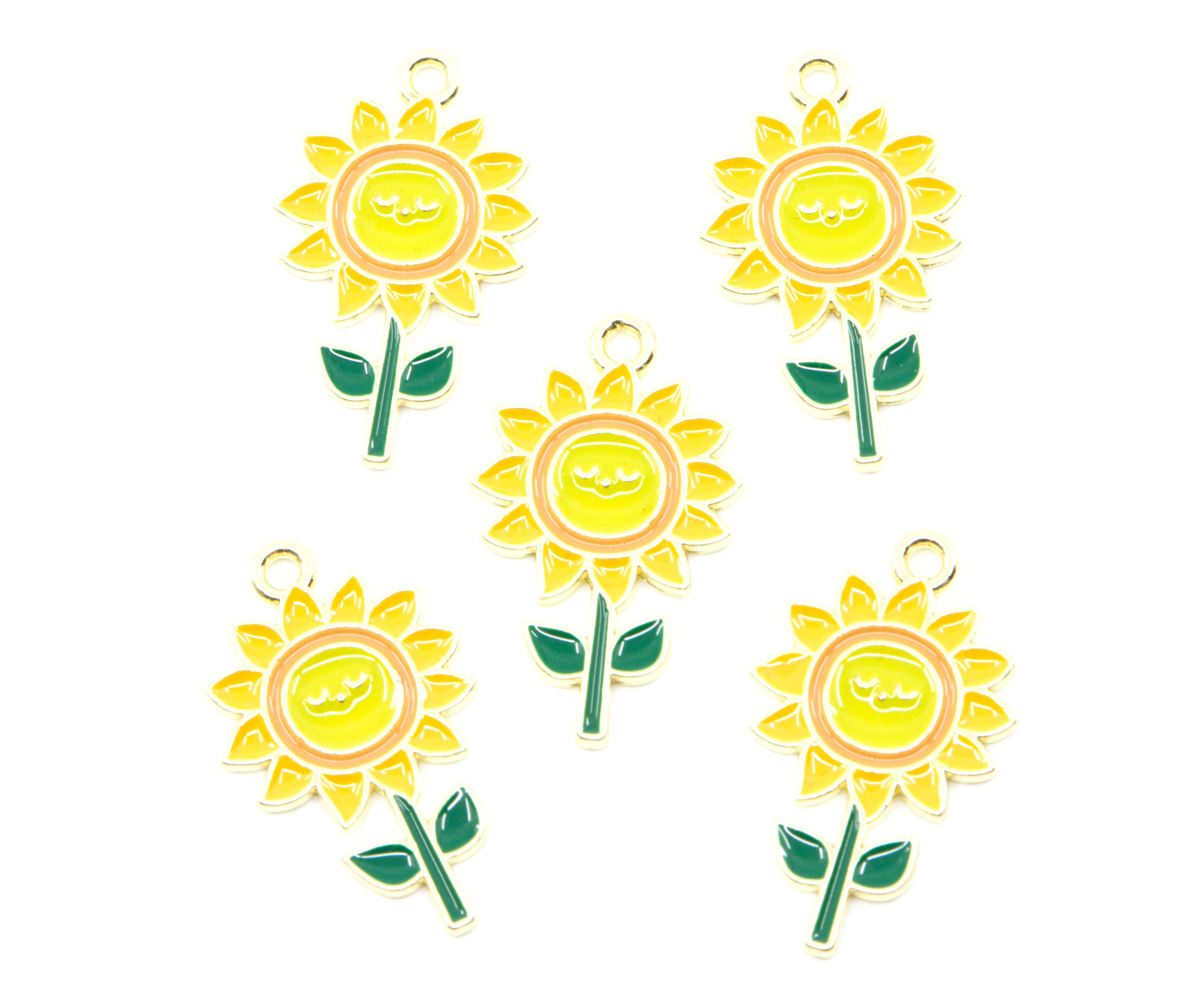 Five yellow sunflower charms with green stems and leaves, each featuring a small gold-tone loop at the top, arranged on a plain white background.